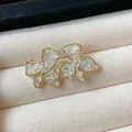 Close-up of elegant 18K gold plated lace flower stud earrings with crystal center - Style 1 / Gold