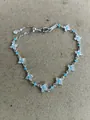 Elegant silver four-leaf clover bracelet with sparkling white zircons and turquoise stones - Silver-Blue