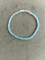 Elegant silver-toned bracelet featuring rectangular light blue zircon and clear stones - Bracelet / Silver Blue