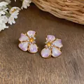 Detailed macro shot of elegant pearlescent purple flower earrings with gold edges - Silver Post (HE33386) / Pink