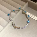 Detailed view of an elegant silver tennis bracelet featuring sparkling blue heart-shaped zircons - 22# Bracelet / Silver Blue