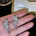 Close-up of sparkling zircon meteor star clip-on earrings with mosquito coil back - Meteor Style Mosquito Coil Ear Clip (HE32621-1) / Silver