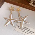 Elegant white enamel starfish drop earrings with gold bead accents for beach holiday style - Starfish Style (HE32834) / White