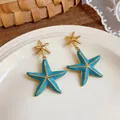 Blue enamel starfish drop earrings with gold-tone finish for trendy summer vacation - Starfish Style (HE32834) / Blue