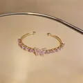Elegant gold butterfly cuff bracelet featuring pink zircon water drops in French style - Gold-Pink