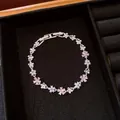 Detailed view of silver flower bracelet with pink zircons and pearls on black tray - Silver Pink
