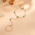 Bracelet de doigt élégant en acier titane doré avec perles turquoise et chiffres romains - Four Blue Sphere Style