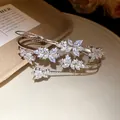 Close-up detail of an elegant silver zircon wheat ear bracelet with sparkling crystals - Silver