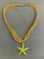 Yellow resin starfish pendant necklace featuring multi-strand organza ribbon cord - Yellow