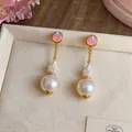 Detail view of French elegant pearl drop earrings with pink phantom beads and gold finish - French Geometric Pearl Drop Earrings (HE33768) / Silver Post-Gold-Pink-Champagne