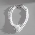 Close-up of multi-layer white crystal bead necklace with intricate flower pendant. - Necklace-White