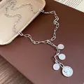 Detailed view of silver metal chain necklace with multiple round portrait coin charms - Portrait Coin Pendant (HN12544) / Silver