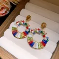 Exquisite colorful crystal hoop earrings displayed in a beige luxury jewelry box - Round Stud with Stone (Silver Earring Post) / Pink