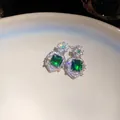 Macro view showing the fine zircon pavé setting on square emerald green drop earrings - Stud Earrings (925 Silver Pin) / Silver-Green
