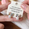 Close-up of elegant butterfly zircon earrings with pearls and S925 silver needles - Silver Needle-Silver-Colorful