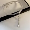 Close-up of double-layered rhinestone necklace with cascading teardrop crystal - Double Layer Teardrop Necklace / Silver