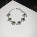 Elegant silver-tone bracelet with sparkling green zircon clusters in a round halo design - 27# Bracelet / Silver/Green