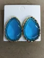 Elegant blue water-drop resin earrings with gold textured frames on white display card. - Gold-Blue