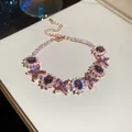 Elegant rose gold bracelet with purple zircons and butterfly motifs on a display box - 37# Bracelet / Rose Gold Purple