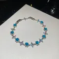 Exquisite sparkling blue and white zircon round bracelet on white textured leather surface - 42# Bracelet / Silver Blue