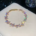 Elegant gold-tone bracelet featuring sparkling pink marquise and clear round zircons. - 44# Bracelet / Gold Pink