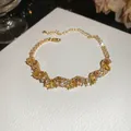 Exquisite gold-plated bracelet featuring shimmering yellow and champagne cubic zirconia. - 52# Bracelet / Gold Yellow