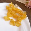 Detail view of yellow chiffon flower tassel earrings with sparkling zircon studs - Yellow