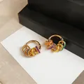 Close-up of 14K gold plated dopamine style earrings with colorful enamel charms - Colorful Hanging Rings Style (HE33077) / Gold