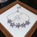 Elegant silver-colored bracelet with purple zircon flower charms in a luxury gift box. - 71# Bracelet / Silver Purple