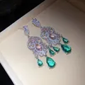 Detailed macro view of vintage chandelier earrings with green and pink water-drop stones - Silver (Silver Pin) / Pink-Green