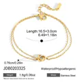 Dettaglio macro del bracciale in acciaio inossidabile dorato con anelli e cristalli - Stile Bracciale con Strass ad Anello Intrecciato (JDB0203325)