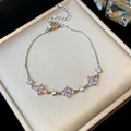 Close-up of elegant silver flower bracelet with pink zircons on a luxury gift box - Flower Style / Silver-Pink