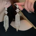 Close-up of sparkling zircon water drop tassel earrings with flower design details - Waterfall Dropping (16#)