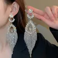 Close-up of sparkling zircon water drop tassel earrings with long fringe detail - Hollow Water Drop Frame (28#)