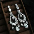 Detailed view of sparkling cubic zirconia teardrop tassel earrings on a brown velvet tray - Gorgeous Geometric Hanging (39#)