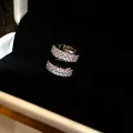Close-up of an elegant 18k gold plated zircon triple layer ear cuff earring for women - Silver-Style 2