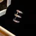 Exquisite detail of a silver-toned three-row ear cuff with sparkling rectangular zircons - Silver-Style 6