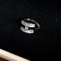 Close-up macro view of minimalist H-shaped ear cuff with sparkling crystal inlays - Silver-Style 3