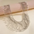 Detailed macro shot of an elegant metallic fringe necklace with shimmering crystal beads - White Crystal Beads / Silver
