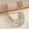 Detailed macro view of layered silver metal ball chain necklace with turquoise crystal beads. - Blue Crystal Beads / Silver