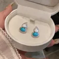 Detailed view of silver needle gourd earrings with turquoise and pearls in a gift box - Gourd Style (HE32786) / Silver