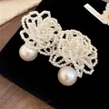 Detailed view of handmade multi-layer pearl flower necklace for elegant styling - Earring Style / White