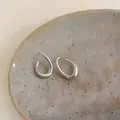 Elegant matte silver twisted oval hoop earrings in minimalist Korean style jewelry - Silver Earring Post Style / Silver