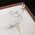 Elegant vintage silver spiral drop earrings featuring unique textured starfish pendants - Bangle / Silver