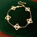 Elegant gold bracelet featuring five hollow clover motifs inlaid with sparkling zircons - Gold