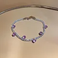 Sparkling tennis bracelet with purple and white zircon stones in a gold setting. - Round Tennis Chain / Pink