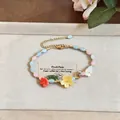Detail view of dainty beaded bracelet featuring colorful resin flower charms and leaf accents - Resin Flower Beaded Bracelet Style 2 / Colorful