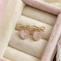 Elegant pink heart earrings with gold bow and sparkling rhinestones in a velvet box - Bowknot Heart Style (HE33237) / Gold-Pink
