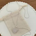 Exquisite hollow mesh heart pendant necklace in silver for a minimalist look. - Silver