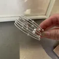 Dettaglio di un bracciale rigido multistrato in argento con perline testurizzate - Stile Design con Perline Multistrato (3#) / Argento
